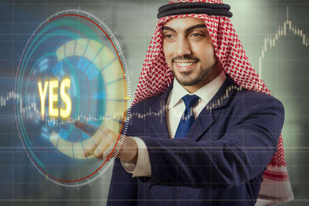 Arab man pressing yes buttonの写真素材