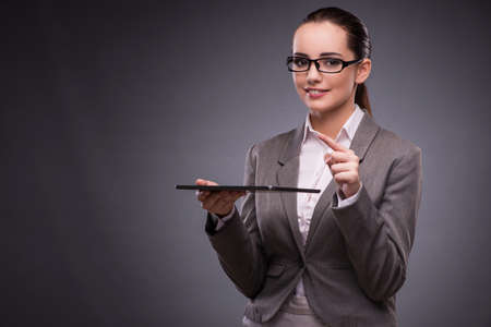Woman with tablet computer in business conceptの写真素材