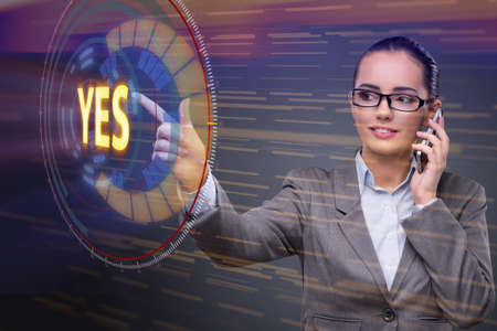 Businesswoman pressing virtual button YESの写真素材