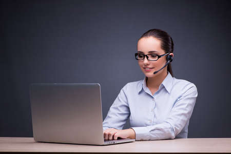 Businesswoman sitting at her desk in business concept