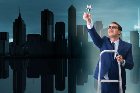 Businessman with star award in business conceptの写真素材