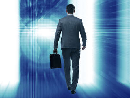 Businessman walking away from the cameraの写真素材