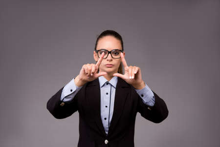Young woman businesswoman pressing virtual buttons
