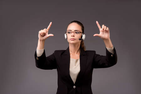 Young woman businesswoman pressing virtual buttons