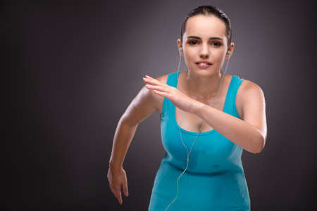 Young woman doing sports in sport conceptの写真素材