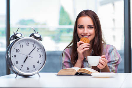 Young girl having breakfast on the morningの写真素材