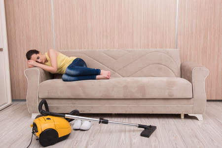 Young woman doing cleaning at homeの写真素材