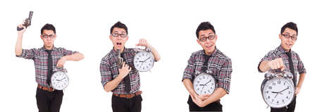 Young man with clock isolated on whiteの写真素材