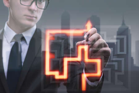 Businessman with maze in difficult situations conceptの写真素材