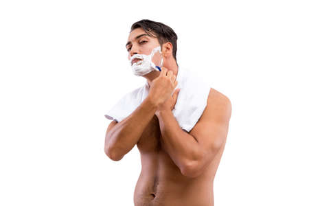 Handsome man shaving isolated on white backgroundの写真素材