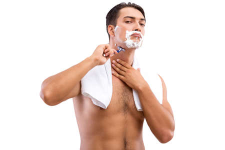 Handsome man shaving isolated on white backgroundの写真素材