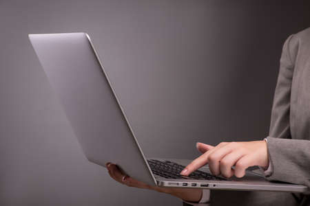 Young businesswoman working with laptop in business conceptの写真素材