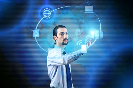 Businessman pressing buttons in computing concept