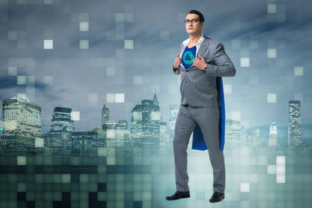 Businessman in superhero concept with red coverの写真素材