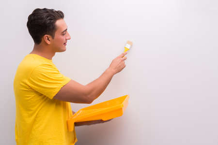 Man painting house in DIY conceptの写真素材