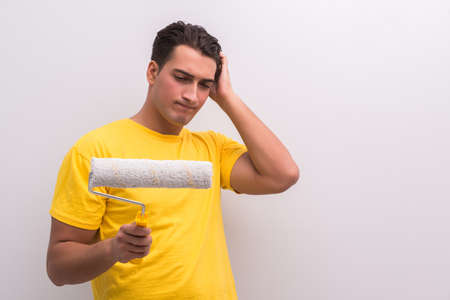 Man painting house in DIY conceptの写真素材