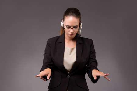 Young woman businesswoman pressing virtual buttonsの写真素材