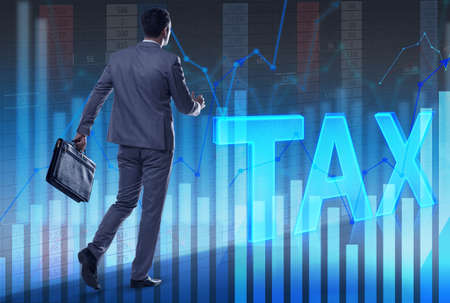 Man walking towards tax lettersの写真素材