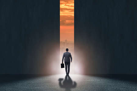 Businessman walking towards his ambitionの写真素材