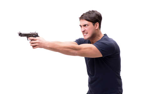Aggressive young man with gun isolated on whiteの写真素材
