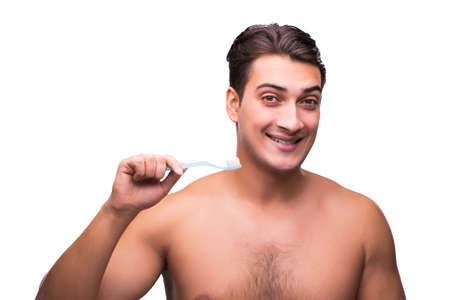 Handsome man brushing his teeth isolated on whiteの写真素材