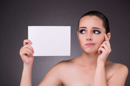 Beautiful woman with blank message paperの写真素材
