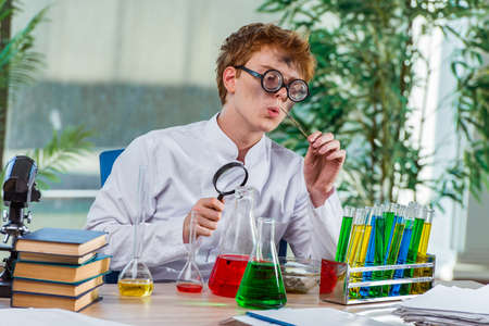 Young crazy chemist working in the lab