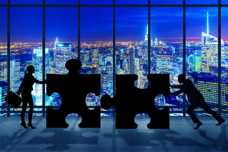 Business concept of teamwork with jigsaw puzzle