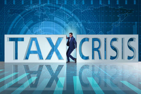 Businessman in tax and crisis conceptの写真素材