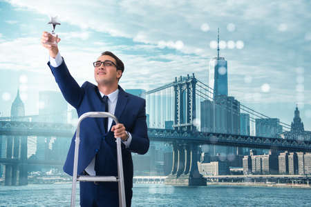 Businessman with star award in business conceptの写真素材