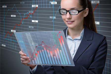 Businesswoman in online stock trading business conceptの写真素材