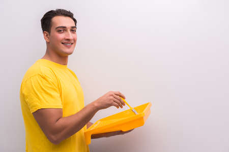 Man painting house in DIY concept