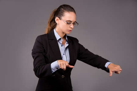 Young woman businesswoman pressing virtual buttonsの写真素材