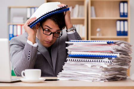 Handsome businessman working in the officeの写真素材