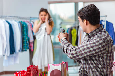 Man fed up with wife shopping in shopの写真素材