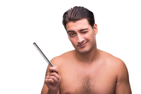 Man brushing his hair isolated on whiteの写真素材