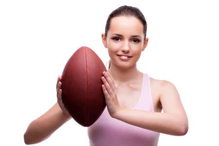 Young woman with american football isolated on whiteの写真素材