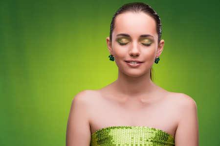 Young woman in beauty concept on green backgroundの写真素材