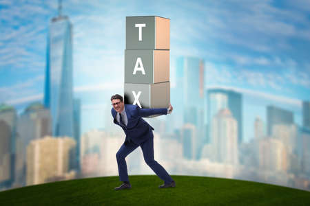 Businessman under heavy tax burdenの写真素材