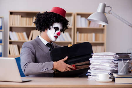 Clown businessman working in the officeの写真素材