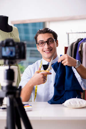 Young man working as fashion video bloggerの写真素材