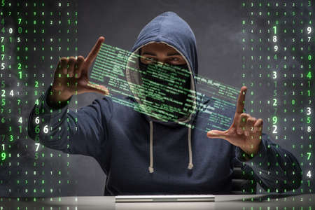 Young hacker in data security concept