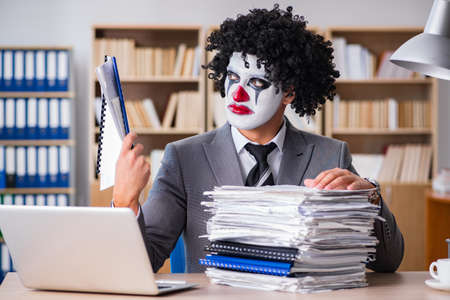 Clown businessman working in the officeの写真素材