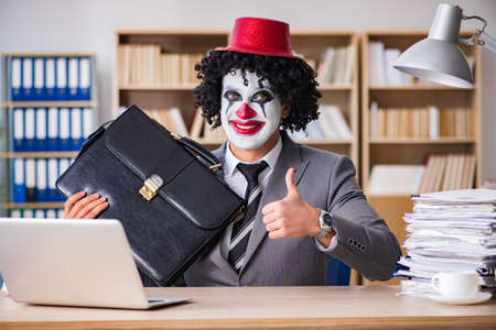 Clown businessman working in the officeの写真素材