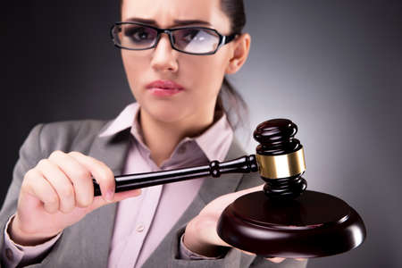 Woman judge with gavel in justice conceptの写真素材