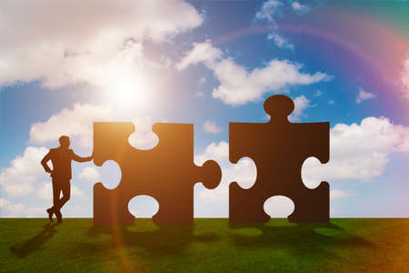 Business metaphor of teamwork with jigsaw puzzle