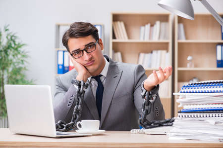 Handsome businessman working in the officeの写真素材