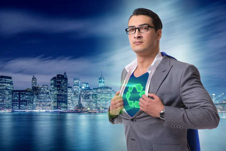 Businessman in superhero concept with red coverの写真素材