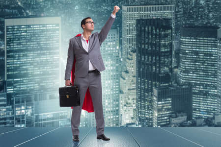 Businessman in superhero concept with red coverの写真素材