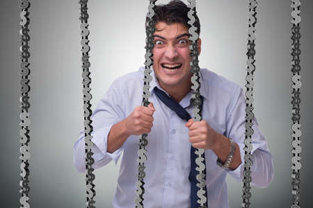Man trapped in prison with dollarsの写真素材